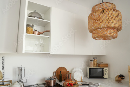 Open cupboard with utensils...