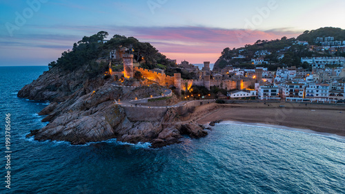 Quadro su tela Aerial view of illuminated Vila Vella at sunset, Tossa de Mar, Costa Brava