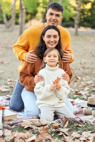 Happy family sitting on pic...