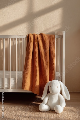 Minimalist Nursery Interior with Wooden Crib and Orange Blanket