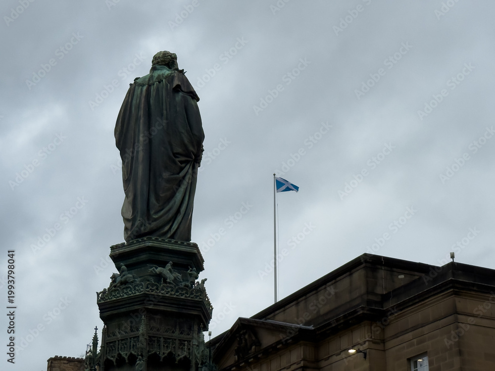 Fototapeta premium Scotland Flag Waving in Scenic Locations Across Scotland – National Saltire Symbol in Outdoor Landscapes