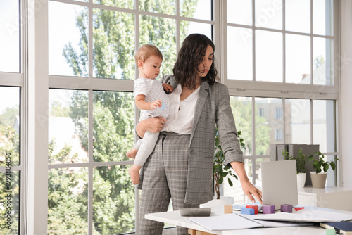 Working mother with her lit...