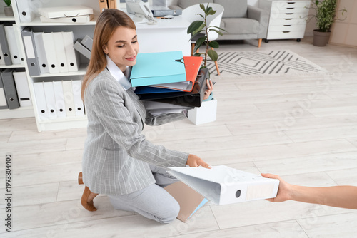 Young businesswoman taking ...