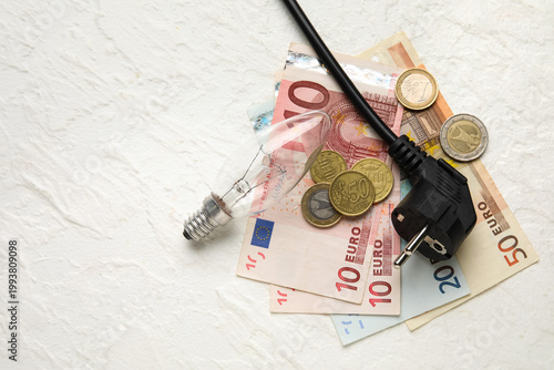 Plug with money, coins and ...