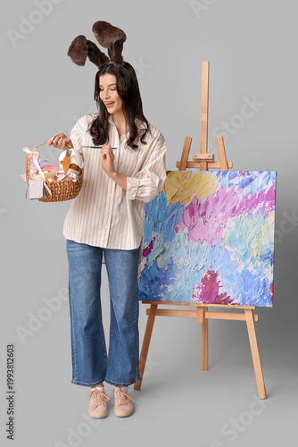 Shocked female artist in bu...