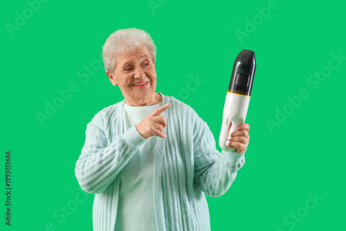 Senior woman pointing at ha...