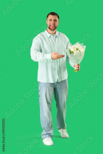Handsome man with flowers o...