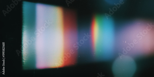 Abstract light leak with rainbow colors and film grain texture