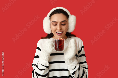 Young woman in warm mittens...