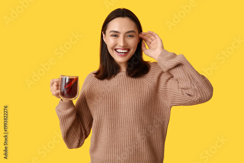Happy young woman with glas...