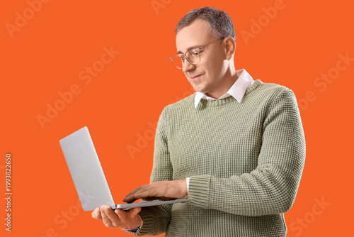 Mature man in eyeglasses us...