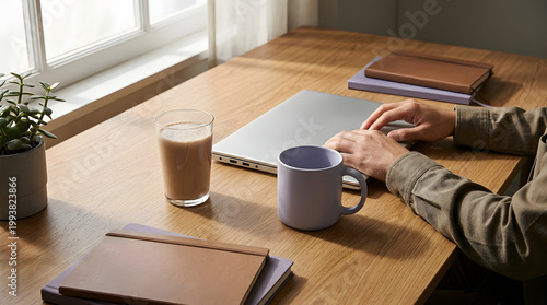 Protein Shake and Laptop on Desk for Wellness and Productivity