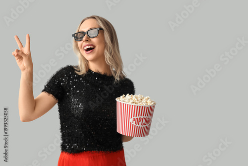 Young woman in 3D glasses w...