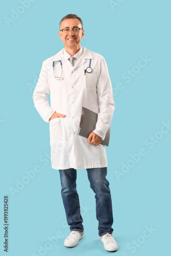 Mature doctor in medical go...