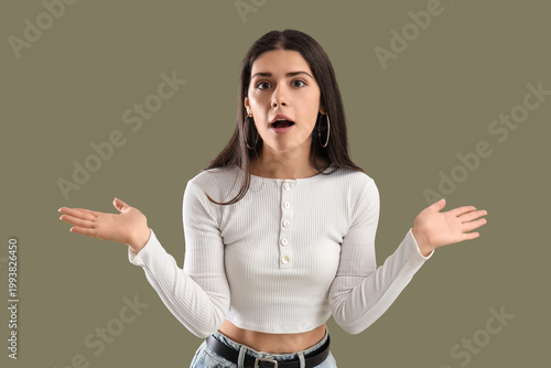 Slika na platnu Young gossip woman on green background