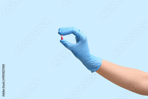 Hand of doctor in glove wit...