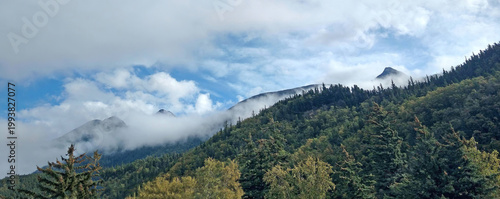Alaska panoramic landscape on the Kenai Pennisula - Early morning mist parts to expose the mountain range