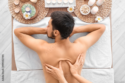 Young man getting massage i...
