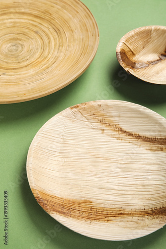 Wooden plates and bowl on g...