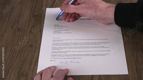 Close-up of a male hand circling Request for not cutting the salary text with a pen. Workplace negotiation, employee rights and HR paperwork concept. 