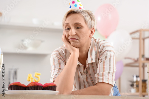 Upset mature woman celebrat...