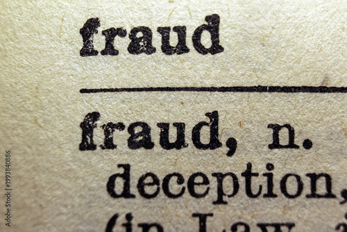 Photography Word fraud printed on dictionary page, macro close up