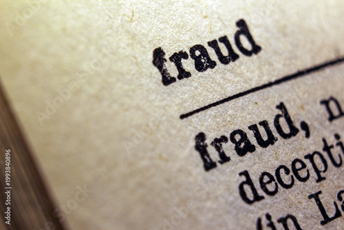 Photography Word fraud printed on dictionary page, macro close up