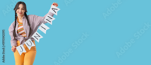 Young happy woman holding b...