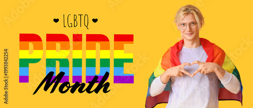 Young man with LGBT flag ma...