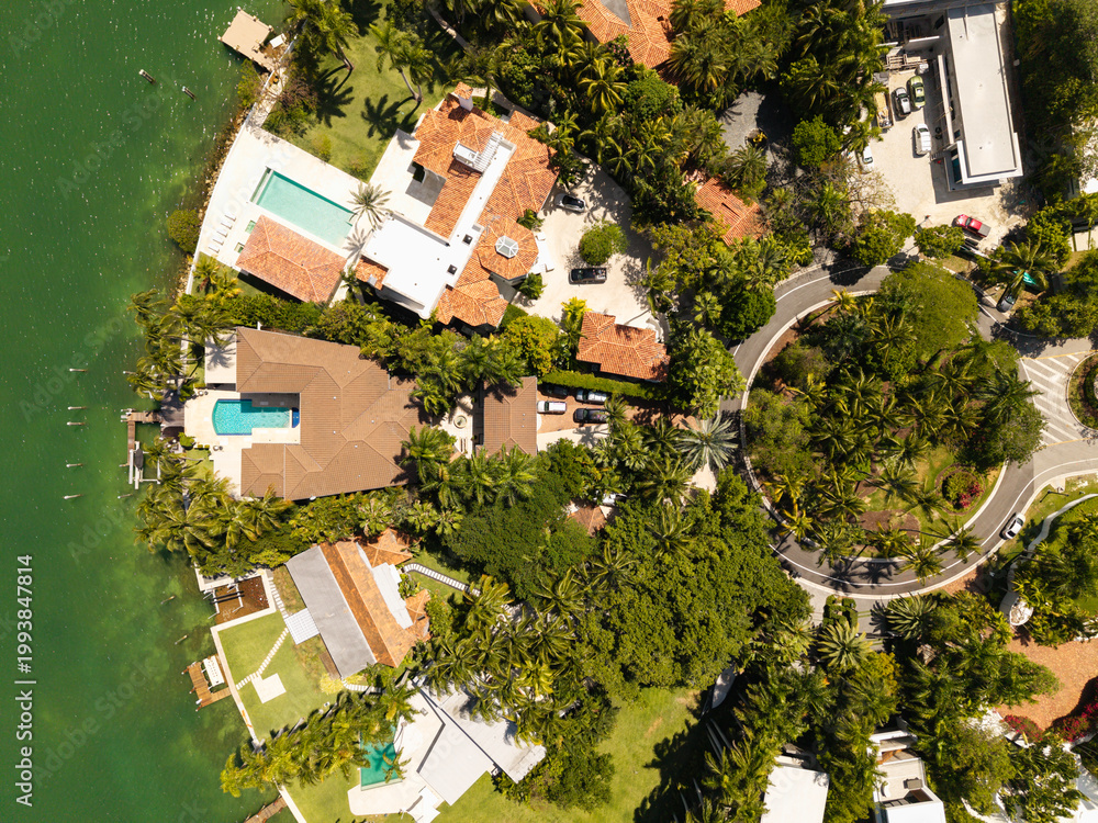 Fototapeta premium Star Island in Miami beach for summer vacation. Residential buildings in luxury Star island surrounded by sea. Waterfront residential area on Star island, Miami. Florida landscape view