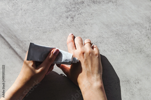 Applying Hand Cream in Natural Light