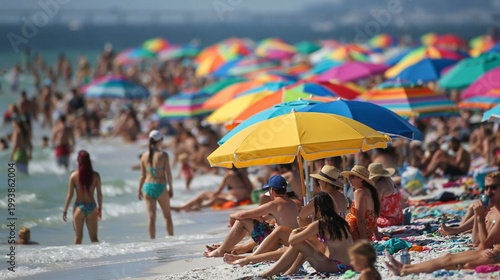 Crowded beach with colorful umbrellas and people