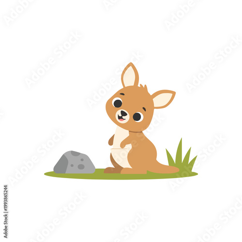 A cute, small cartoon kangaroo stands on a patch of green grass beside a grey rock, looking cheerful with a small smile.