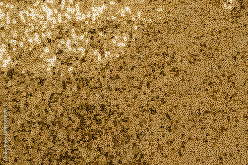 Bild auf Leinwand Golden sequins create a bright and shiny surface for a festive event or party in
