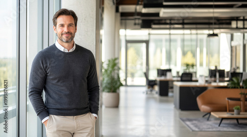 Confident Businessman Standing in Modern Office Interior with Copy Space