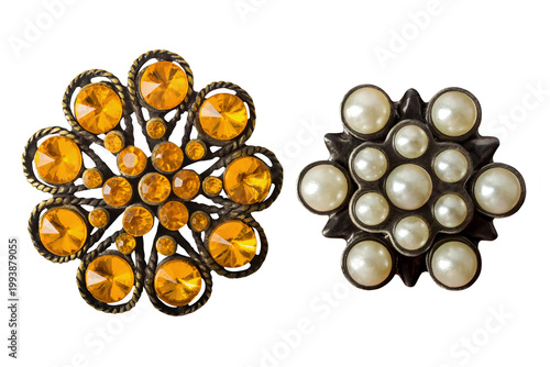 Isolated photo of bronze vintage metal flower pendant with stones on white backdrop.