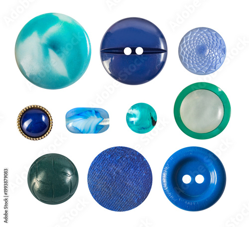 Isolated photo of various blue toned cloth buttons mix on white backdrop.