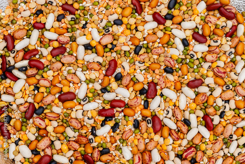 Foto Mix of different beans and legumes arranged on a surface at a market for sale