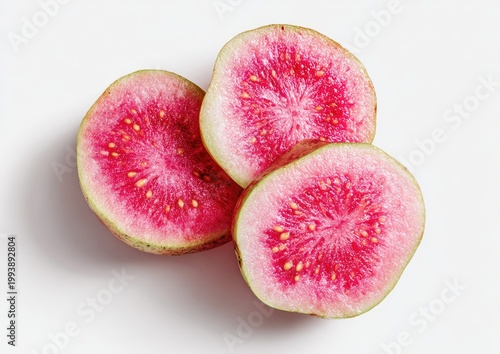 Close-up of three sliced, vibrant pink guava fruit pieces on a white backdrop