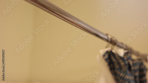 Household Shower Curtain Being Opened