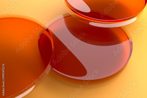 Foto Glossy amber circular liquid discs on warm yellow surface for abstract background and wallpaper design
