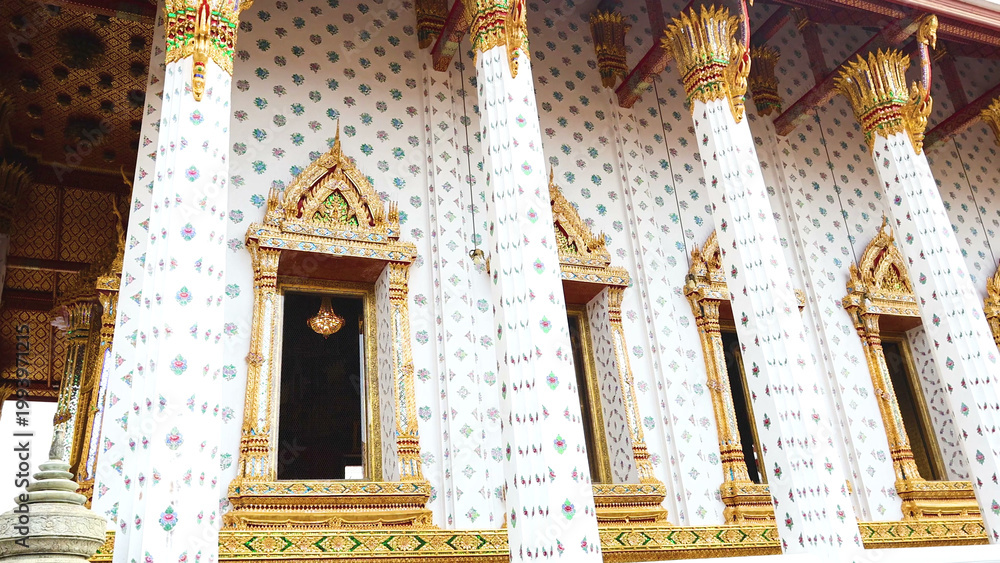 Fototapeta premium Ornate White Columns and Golden Window Frames at Temple of Emerald Buddha