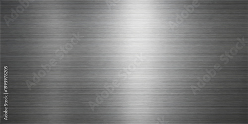 A polished silver stainless steel plate featuring a brushed metal texture on a shiny industrial aluminum surface with a grey metallic pattern and reflections