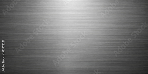 Polished silver brushed metal plate with a shiny stainless steel texture featuring a gray industrial aluminum surface pattern and metallic reflection on a grey material backdrop