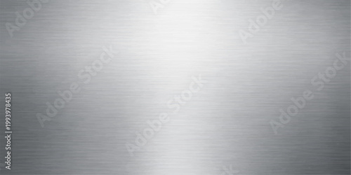 Polished silver stainless steel plate with a brushed metal texture featuring a shiny metallic aluminum surface and industrial gray pattern