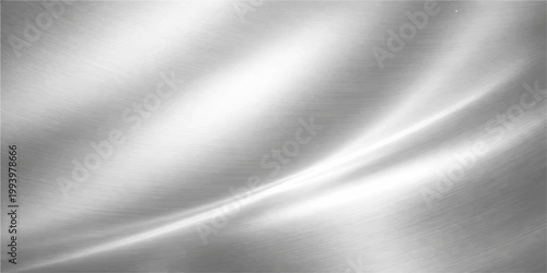 Smooth brushed metal texture with a shiny silver metallic pattern on a stainless steel plate surface for a gray aluminum backdrop design