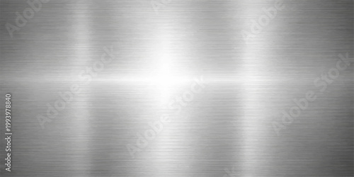 A shiny silver brushed metal texture pattern with a polished stainless steel surface and grey industrial aluminum plate reflection as a smooth metallic backdrop