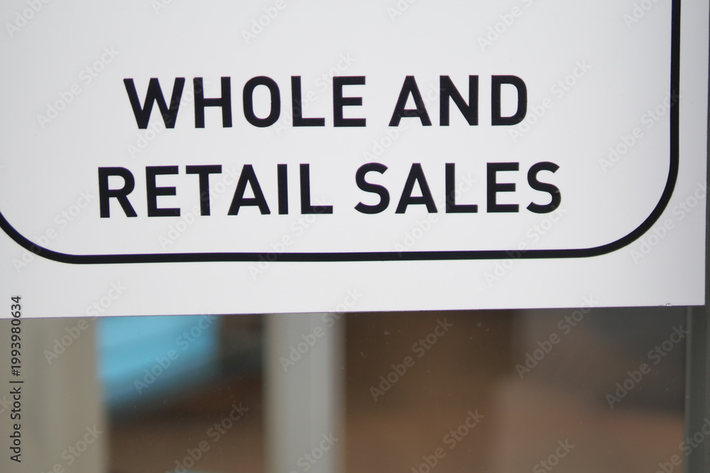 Obraz premium Whole and retail sales sign in a store window