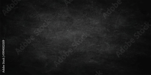 Empty dark grunge paper texture with black and white chalk on a rough vintage blackboard surface creating a dirty gray concrete wall backdrop design