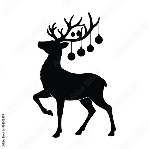 Christmas deer silhouette with ornaments hanging from antlers
